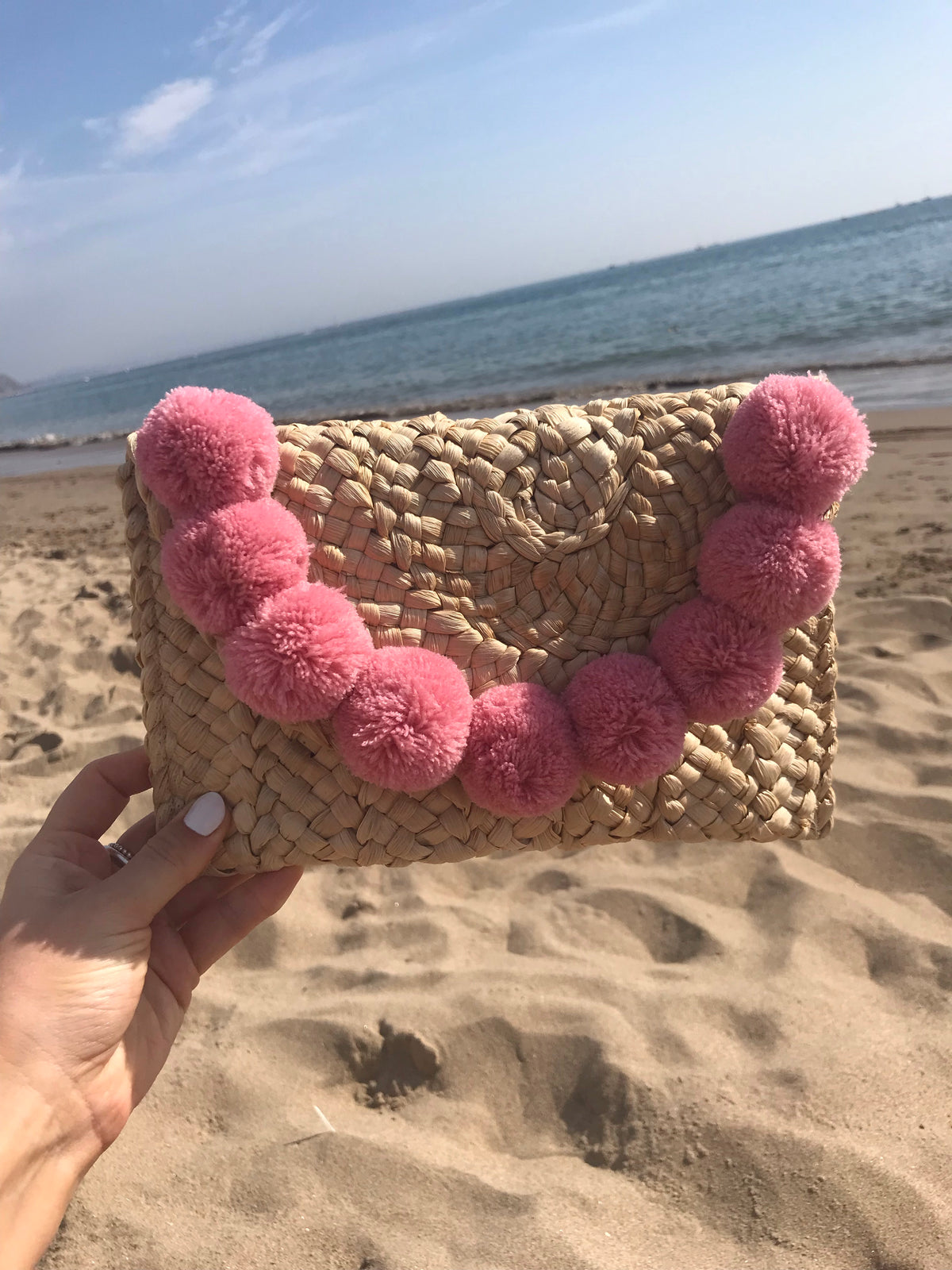 CAPRI POM POM CLUTCH